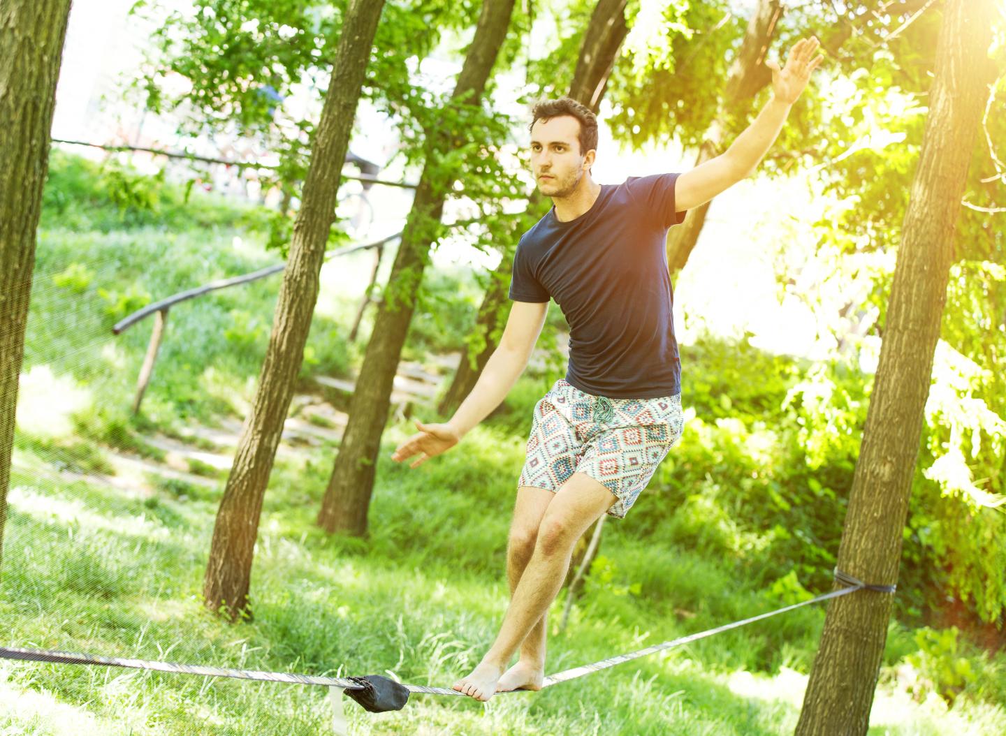 young guy on slack line.