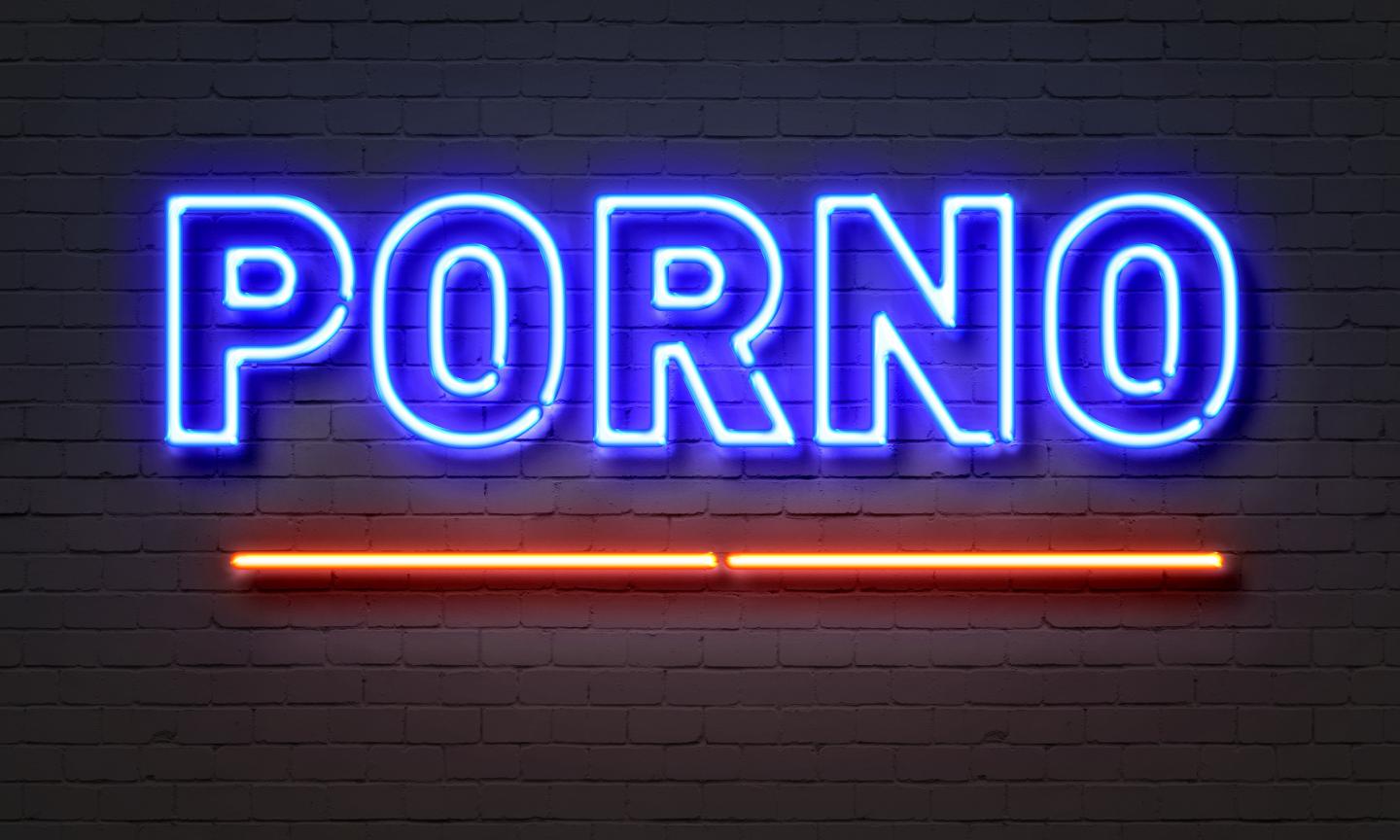 Schild mit Neonschriftzug Porno